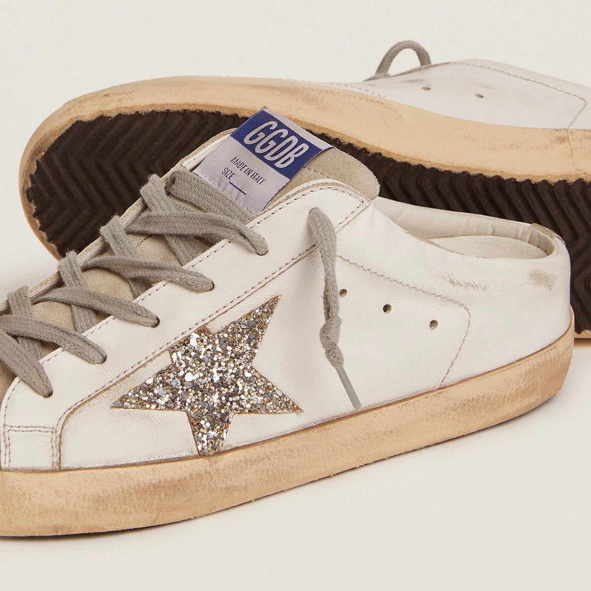 Super-Star Sabot with a platinum glitter star and suede tongue