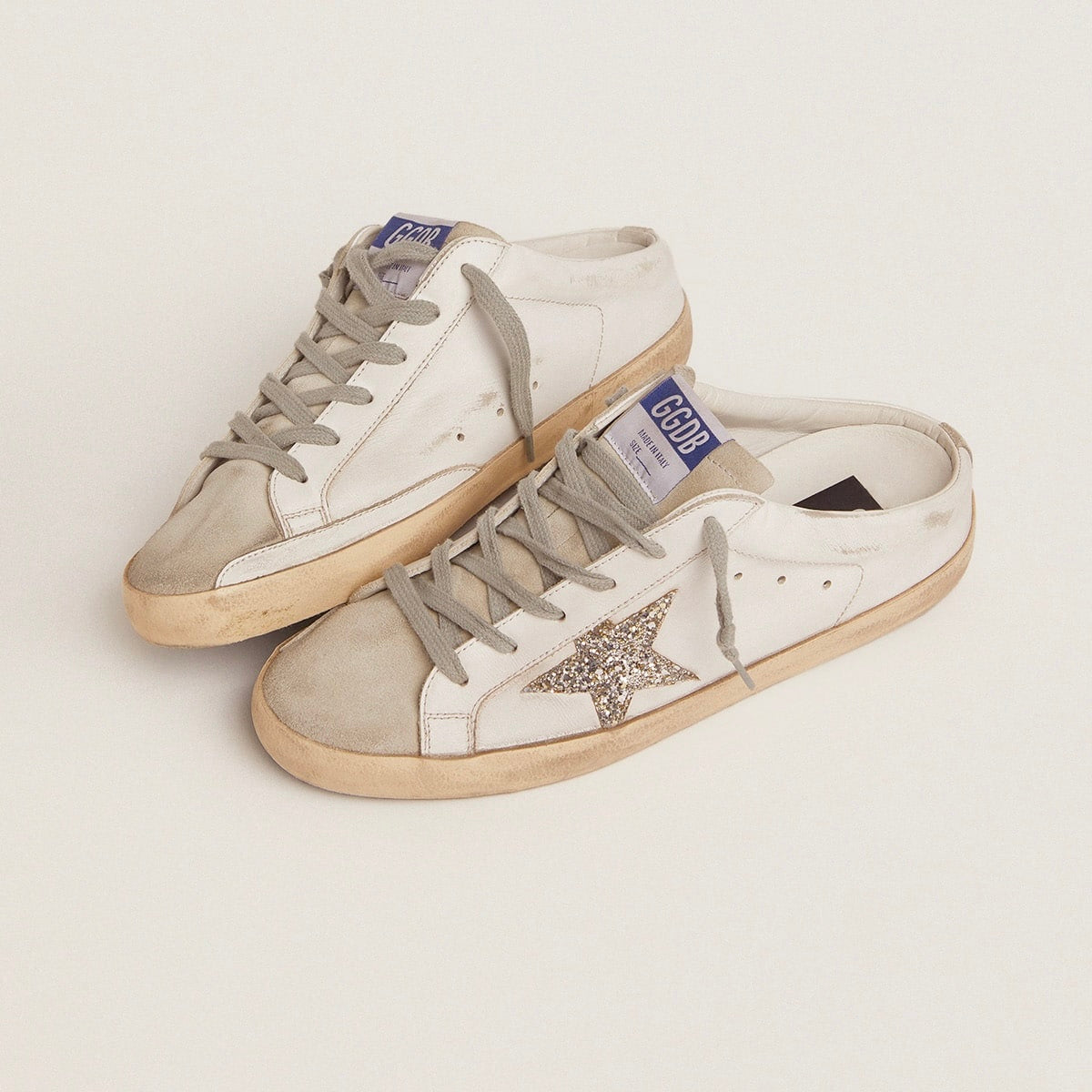 Super-Star Sabot with a platinum glitter star and suede tongue